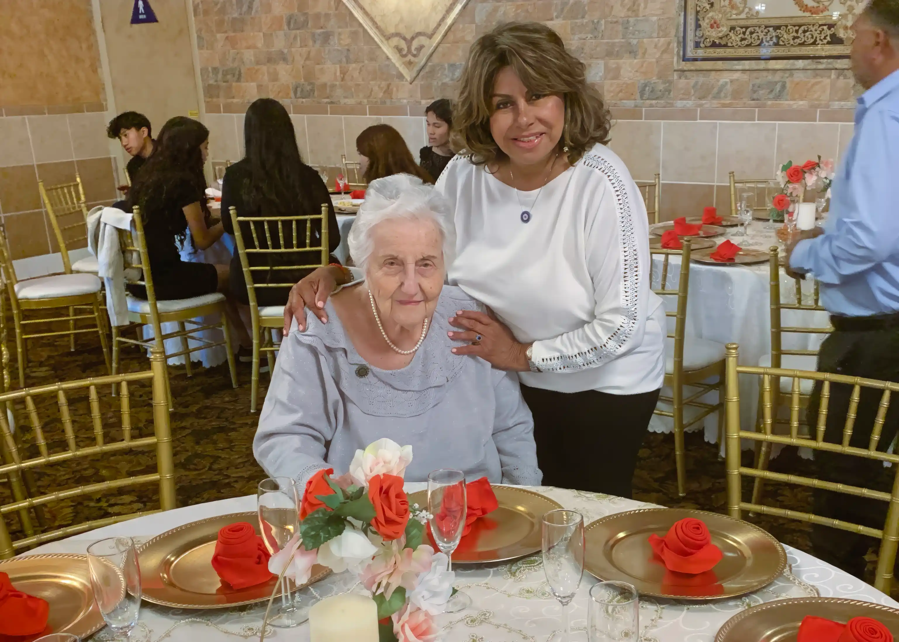 A photo of Sonia posing with a client